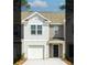 Charming two-story home features a light gray exterior, a single-car garage and a concrete driveway at 122 Haventree Ct, Summerville, SC 29486
