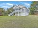 Inviting exterior featuring a raised foundation with garage parking and convenient stairway access to the living space at 1224 Midvale Ave, Charleston, SC 29412