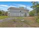 Exterior view of a home with siding, a porch, and ample green space at 1224 Midvale Ave, Charleston, SC 29412