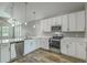 Well-equipped kitchen featuring stainless appliances, pendant lighting, and ample counter space at 1224 Midvale Ave, Charleston, SC 29412