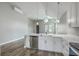 Modern kitchen with an island, stainless steel appliances, and stylish pendant lighting at 1224 Midvale Ave, Charleston, SC 29412