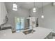 Bright kitchen featuring stainless steel appliances, white cabinets, and access to the back deck at 1224 Midvale Ave, Charleston, SC 29412