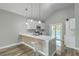 Stylish kitchen featuring stainless steel appliances, a breakfast bar, and a sliding glass door at 1224 Midvale Ave, Charleston, SC 29412