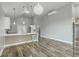 Open kitchen and living space with modern finishes and a large island with bar seating at 1224 Midvale Ave, Charleston, SC 29412