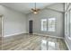 Spacious living area featuring vaulted ceilings, natural light, and wood-style flooring, creating a bright and airy ambiance at 1224 Midvale Ave, Charleston, SC 29412