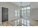 Bright living room boasts vaulted ceilings, wood floors, and a wall of windows with abundant natural light at 1224 Midvale Ave, Charleston, SC 29412