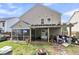 The backyard boasts a covered patio with outdoor seating, screened porch, and a fire pit at 1252 Wild Goose Trl, Summerville, SC 29483