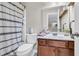 Bathroom with shower featuring a white patterned shower curtain, a toilet, and wood vanity with sink at 1252 Wild Goose Trl, Summerville, SC 29483