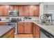 A partial view of a kitchen with a double oven, a microwave and a sink at 1252 Wild Goose Trl, Summerville, SC 29483