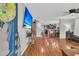 Inviting living area showcasing hardwood floors and an open layout leading to the dining area and kitchen at 1252 Wild Goose Trl, Summerville, SC 29483
