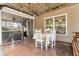 Covered patio with a ceiling fan, outdoor table, chairs, and access to the screened porch at 1252 Wild Goose Trl, Summerville, SC 29483