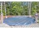 View of the covered above ground swimming pool on a wooden deck surrounded by mature trees at 1252 Wild Goose Trl, Summerville, SC 29483