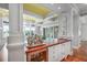Cozy bar area complete with wine storage and a sink, perfect for entertaining at 126 Balfour Dr, Charleston, SC 29492