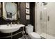 Elegant bathroom featuring a stylish mirror, a sleek sink, and a modern glass-enclosed shower at 126 Balfour Dr, Charleston, SC 29492