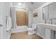 Cozy bathroom with a shower-tub combo, tiled floor, and a modern pedestal sink at 126 Balfour Dr, Charleston, SC 29492