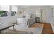 This bright bedroom has natural light, a sitting area and a neutral color palette at 126 Balfour Dr, Charleston, SC 29492