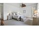 Cozy bedroom with neutral colors, plush carpeting, and a comfortable seating area at 126 Balfour Dr, Charleston, SC 29492