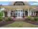 Lovely covered patio featuring ceiling fans, comfortable seating, and an inviting outdoor space for relaxation at 126 Balfour Dr, Charleston, SC 29492
