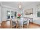Well-lit dining area with a large round table and decorative light fixture creating an inviting space at 126 Balfour Dr, Charleston, SC 29492