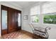 Elegant entryway with beautiful wood door, bench seating, and hardwood flooring at 126 Balfour Dr, Charleston, SC 29492