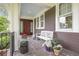 Charming front porch with a seating area and potted plants, creating a welcoming entrance to the home at 126 Balfour Dr, Charleston, SC 29492