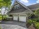 Exterior view of garage doors with driveway and landscaping at 126 Balfour Dr, Charleston, SC 29492