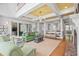 Open concept living room with high ceilings and access to outdoor dining area at 126 Balfour Dr, Charleston, SC 29492