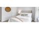 Inviting bedroom with a tufted headboard, decorative pillows, and soft, natural light filtering through the window at 132 Haventree Ct, Summerville, SC 29486