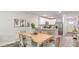 Bright dining area connects to the kitchen, featuring a wood table, providing an inviting space for gatherings and dining at 132 Haventree Ct, Summerville, SC 29486