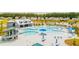 A stunning aerial view of a resort style community pool area with several pools, slides and lots of seating at 134 Haventree Ct, Summerville, SC 29486