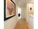 Upstairs hallway with neutral carpet and decor, leading to bedrooms at 136 Haventree Ct, Summerville, SC 29486