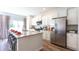 Eat-in kitchen with white cabinets, stainless steel appliances, and granite island at 136 Haventree Ct, Summerville, SC 29486