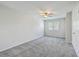 This bedroom has neutral carpet and a ceiling fan at 1421 Dove Run Dr # C, Charleston, SC 29412