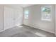 This bedroom has neutral colored walls and a closet at 1421 Dove Run Dr # C, Charleston, SC 29412