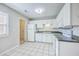 This kitchen has white appliances and tile floor at 1421 Dove Run Dr # C, Charleston, SC 29412