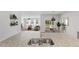 Open-concept kitchen featuring granite countertops, stainless steel sink, and seamless view to living and dining area at 177 Morning View Way, Moncks Corner, SC 29461