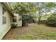 Spacious backyard with mature trees and a privacy fence, offering a tranquil outdoor space at 181 Commons Way, Goose Creek, SC 29445