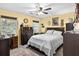 Serene bedroom with neutral walls, ceiling fan, and comfortable furniture, creating a peaceful retreat at 181 Commons Way, Goose Creek, SC 29445