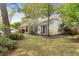 Charming single-Gathering home featuring a well-maintained lawn and mature trees, offering a serene and inviting atmosphere at 181 Commons Way, Goose Creek, SC 29445