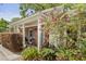 Close up on a charming home's front with blooming plants and classic architectural details at 181 Commons Way, Goose Creek, SC 29445