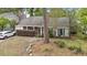 Inviting home with manicured bushes, a well-kept lawn, and brick accents, providing a welcoming curb appeal at 181 Commons Way, Goose Creek, SC 29445