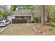 Inviting home with manicured bushes, a well-kept lawn, and brick accents, providing a welcoming curb appeal at 181 Commons Way, Goose Creek, SC 29445