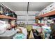 Garage with lots of storage and miscellaneous items in boxes and on shelves against the back wall at 181 Commons Way, Goose Creek, SC 29445