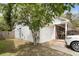 Spacious two-car garage with additional storage space and access to the side yard and back patio at 181 Commons Way, Goose Creek, SC 29445