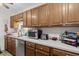 Kitchen featuring ample wood cabinetry, stainless steel appliances, and long countertops at 181 Commons Way, Goose Creek, SC 29445