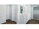 Well-lit bathroom featuring a double sink vanity and entry to closet at 181 Morning View Way, Moncks Corner, SC 29461