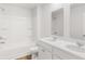 Bright bathroom featuring a dual sink vanity, shower, and tub with white finishes at 181 Morning View Way, Moncks Corner, SC 29461
