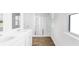 Bathroom featuring dual sinks, wood look floors, and a glass enclosed shower at 181 Morning View Way, Moncks Corner, SC 29461