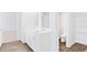 Bright bathroom showcasing a dual vanity with modern fixtures and wood flooring at 181 Morning View Way, Moncks Corner, SC 29461