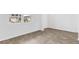 Bright bedroom featuring wood-look flooring, natural light from a large window, and neutral wall paint at 181 Morning View Way, Moncks Corner, SC 29461